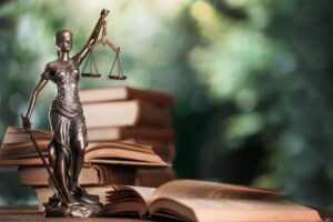 Closeup of a sculpture of Themis, mythological Greek goddess, symbol of justice, blind and holding empty balance in her hand