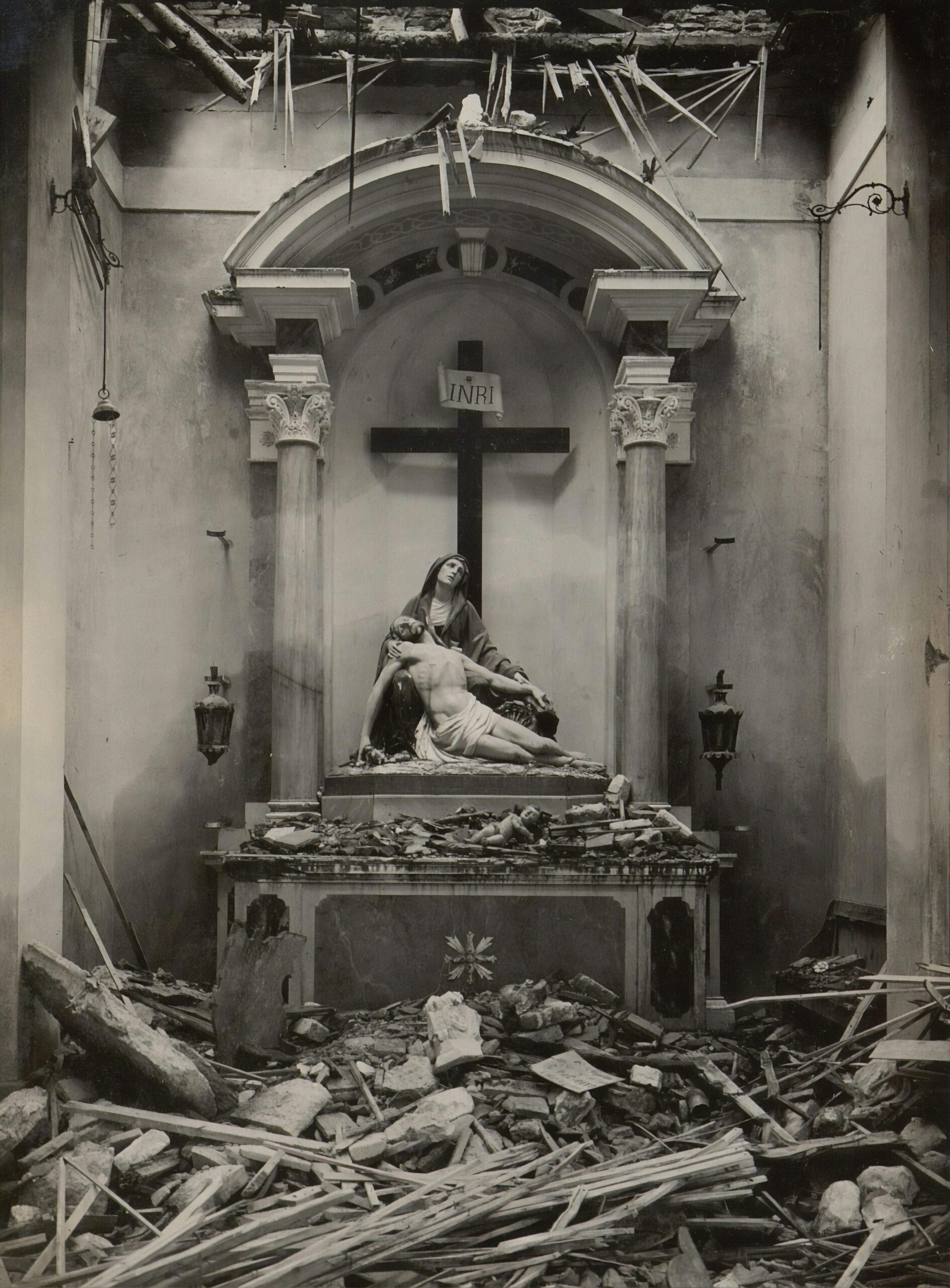 A crumbling church interior with a Pietà statue still standing at the altar. The collapsed ceiling, shattered beams, and scattered debris mirror the Church’s institutional failures, while the intact statue of Mary and Jesus evokes the suffering of survivors. A haunting visual of faith enduring amidst the ruins of corruption and neglect